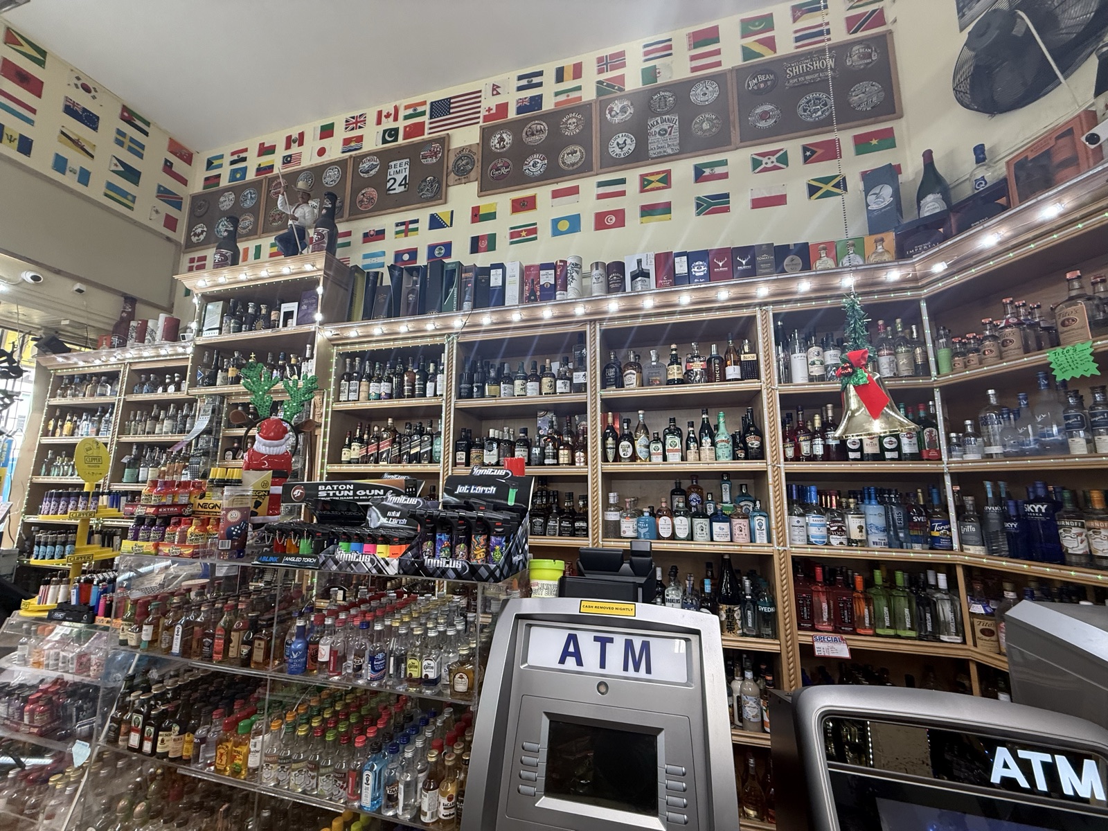 Inside Eddy's Market — spirits wall and ATM