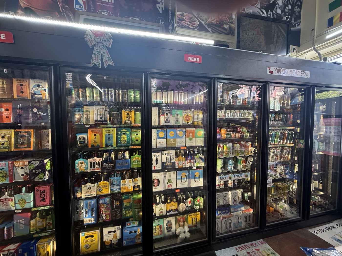 Inside Eddy's Market — the beer cooler wall