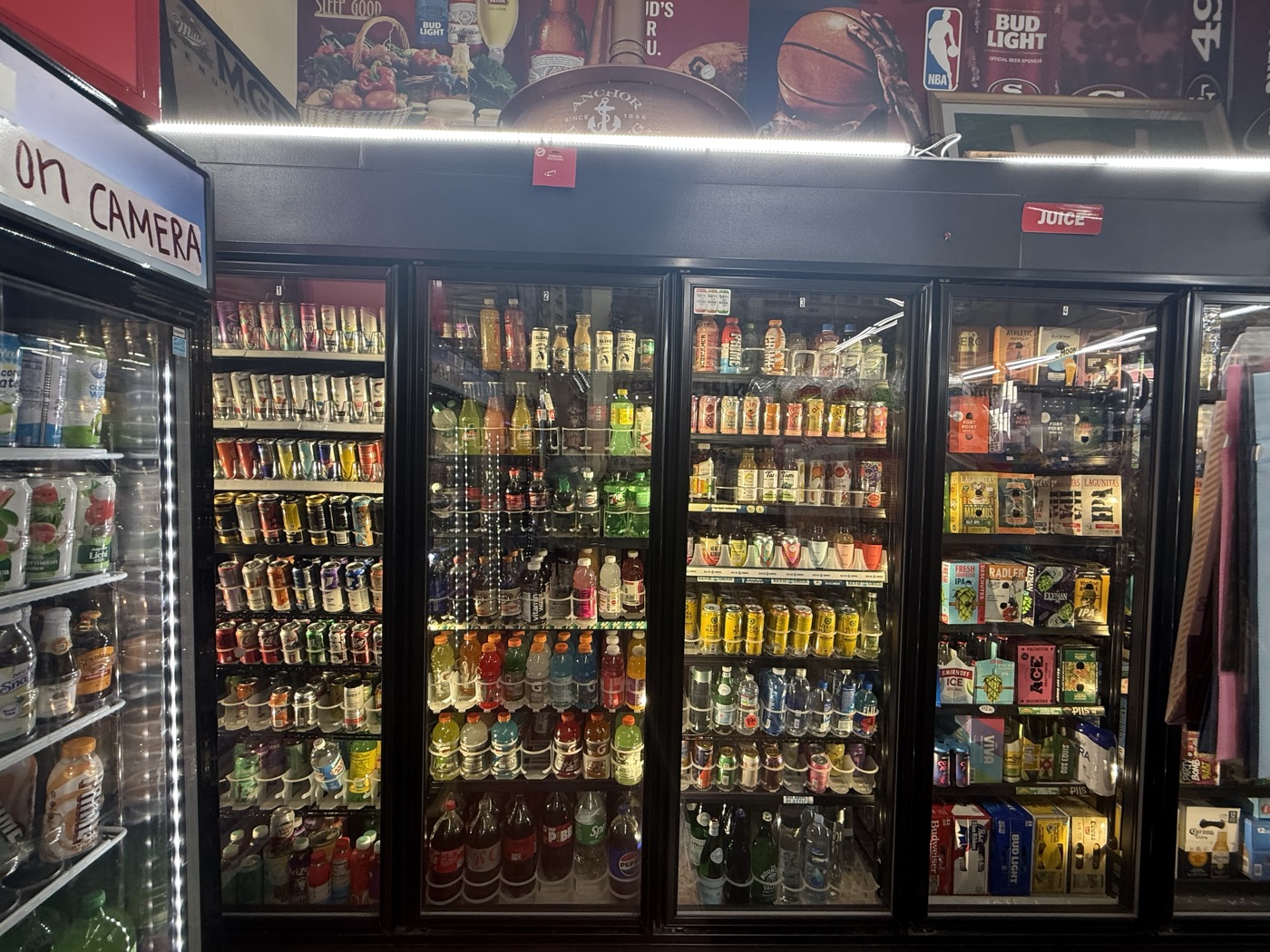 Inside Eddy's Market — juice and soda coolers