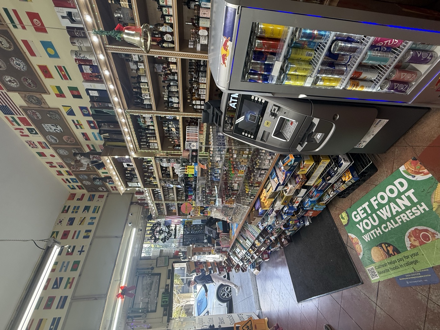 Inside Eddy's Market — the front counter looking out to Irving Street